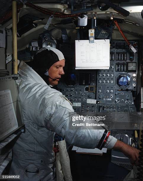 Kennedy Space Center, FL- Apollo 11 Commander Neil Armstrong is going through flight training in the lunar module simulator situated in the...