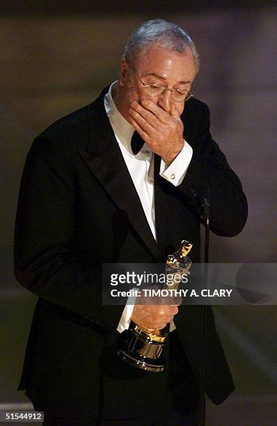 Actor Michael Caine holds his Oscar for Best Performance by an Supporting Actor in a Leading Role during the 72nd Academy Awards 26 March 2000 at the...