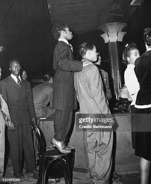 Young African American men in zoot suits at the Savoy Ballroom in Harlem. Photograph, 1930's.