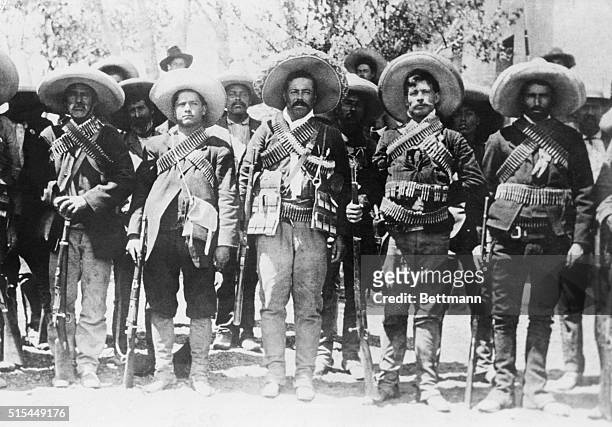 Ca. 1909-1920-Pancho Villa , Mexican bandit and revolutionary leader, lined up with some of his followers.