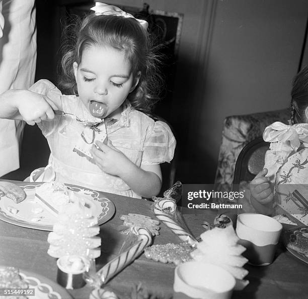 Hollywood, California- Some of the other youngsters were all "agog" at the sight of the camera and array of photographer's lights, but not Liza...