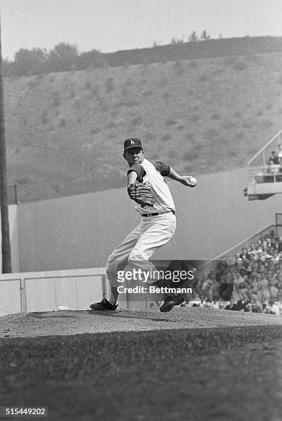 Los Angeles, California- Pitching giant Don Drysdale appears to mean business as he bears down in the fifth inning of the World Series game. Drysdale...
