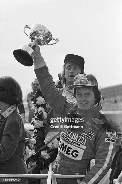 Brands Hatch, England- Canadian Gilles Villeneuve holds the Challenge Trophy for the Formula 1 Race of Champions here 4/15, after he won race in...