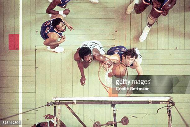 Boston, MA: Overhead view under basket during game 3 of NBA playoffs at Boston Garden. Dave Debusschere of Knicks and Paul Silas of Celtics wait for...