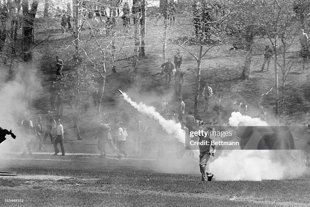 Student Hurls Tear Gas Back