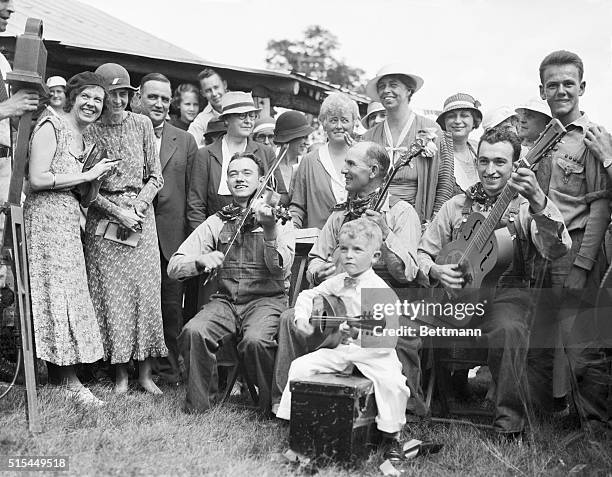 White Top Mountain, Virginia- Mrs. Franklin D. Roosevelt is shown with the group of Virginia "Ridge Runners" who entertained her. This community was...