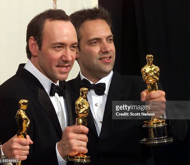 Actor Kevin Spacey and director Sam Mendes hold their Oscars for Best Actor and Best Director for "American Beauty" at the 72nd Annual Academy Awards...