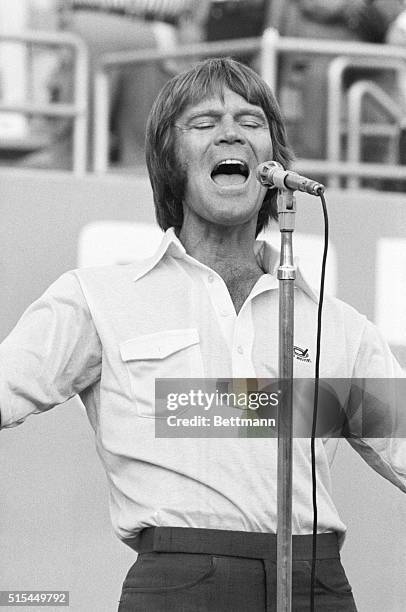 Los Angeles, CA- Singer-actor Glenn Campbell sings the National Anthem at the start of game number three of the National League Playoffs between the...