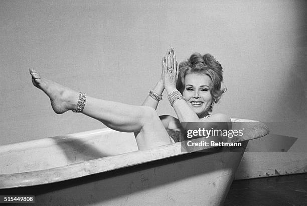 Hollywood, CA- Zsa Zsa Gabor, who replaced Hedy Lamarr in Picture Mommy Dead, clowns in a bathtub on the set of that picture here 2/14. Miss Gabor...
