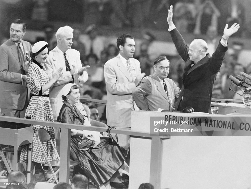 Eisenhower W/Arms Raised On Podium