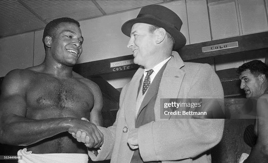 Shirtless Jim Brown Shakes Coach's Hand