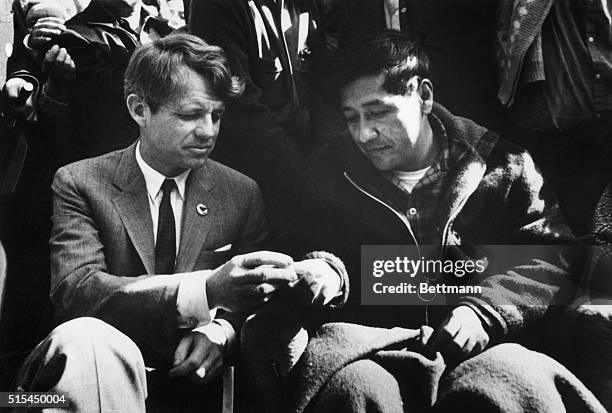 Senator Robert Kennedy breaks bread with Union Leader Cesar Chavez as Chavez ended a 25-day fast in support of non-violence in the strike against...