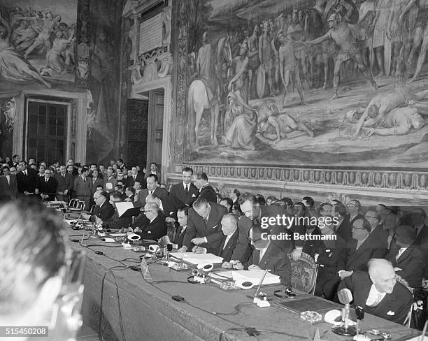 Beneath a fresco of The Horatii and Curatii by D'Arpino, statesmen of six European countries sign treaties for a European Common Market and European...
