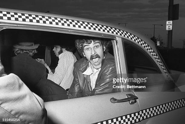 New York, NY- Knick's Phil Jackson prepares to enter a cab at LaGuardia Airport, after the team's return from Boston and a 94-78 win over the...