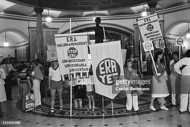 Springfield, IL- Anti and pro ERA forces stand side by side in the main hall of the Illinois State Capital to show their support for and against the...