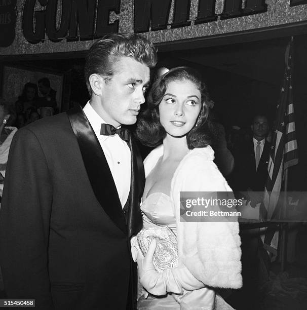 James Dean stands with Italian actress Pier Angeli.