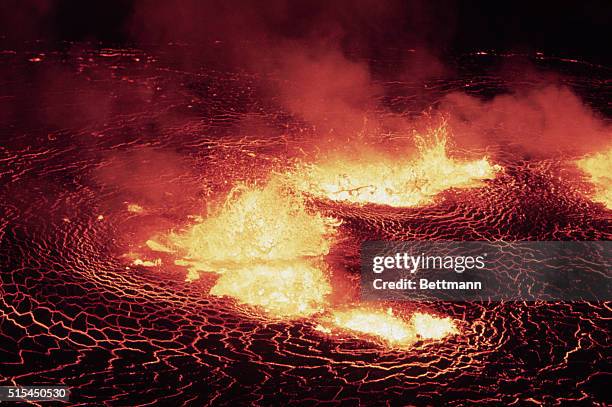 Vestmannaeyjar off Iceland-: Night shots near crater as eruption was in full blast. Slide shows flumes of glowing lava shooting up over the rim of...