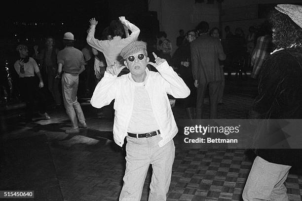 New York, NY-: Truman Capote makes faces at a cameraman at Studio 54 disco nightclub.