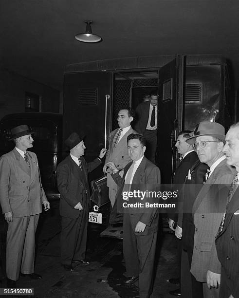 New York, NY: Three of the eleven top US Communist Party leaders to be sentenced for conspiracy arrive in a prison van at the Federal Courthouse....