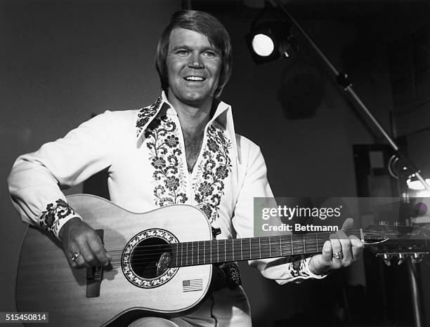 Singer Glen Campbell playing guitar as host of the NBC television show The Midnight Special episode which was broadcast on October 24, 1975 after The...