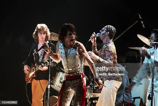 Mick Taylor and Mick Jagger of the Rolling Stones perform with Stevie Wonder at Madison Square Garden. The concert was the final performance of the...