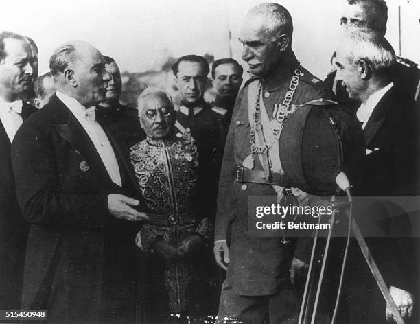 Ankara, Turkey- The two most powerful rulers in the Near East, Turkish President Mustafa Kemal Atatürk , and Reza Shah , Shah of Persia, are holding...