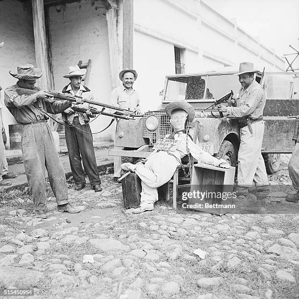 Esquipula, Guatemala- An effigy of former Guatemalan President Jacobo Arbenz is propped against a vehicle as several members of the "Liberation Army"...