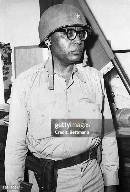 Port-au-Prince, Haiti-: President Francois Duvalier is shown in battle dress, in his office during action against rebels. President Duvalier took an...