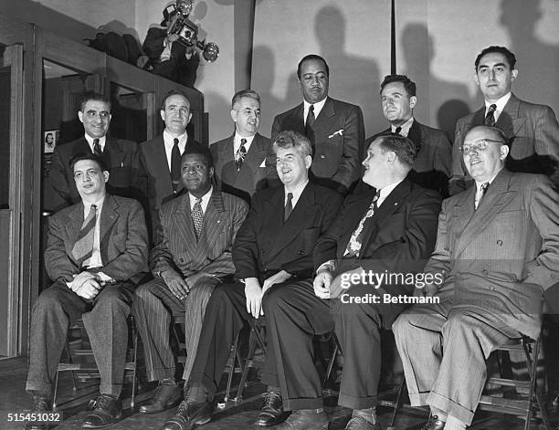 Communist leaders in a courthouse being accused of teaching "Marxist-Leninist principles." Left to right: Robert Thompson; Henry Winston; Eugene...