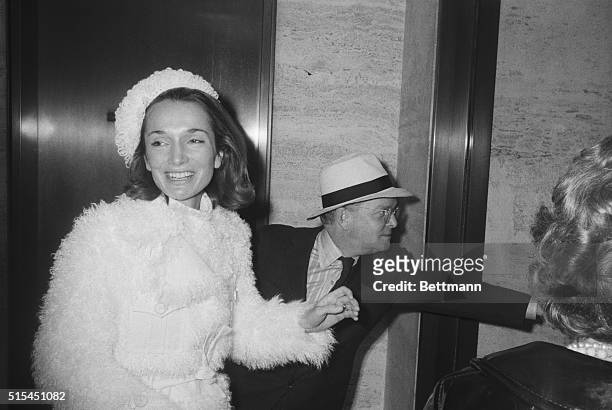 New York, NY- Truman Capote leaves a reception at The Four Seasons with Princess Lee Radziwill, sister of Mrs. Jacqueline Onassis. The reception...