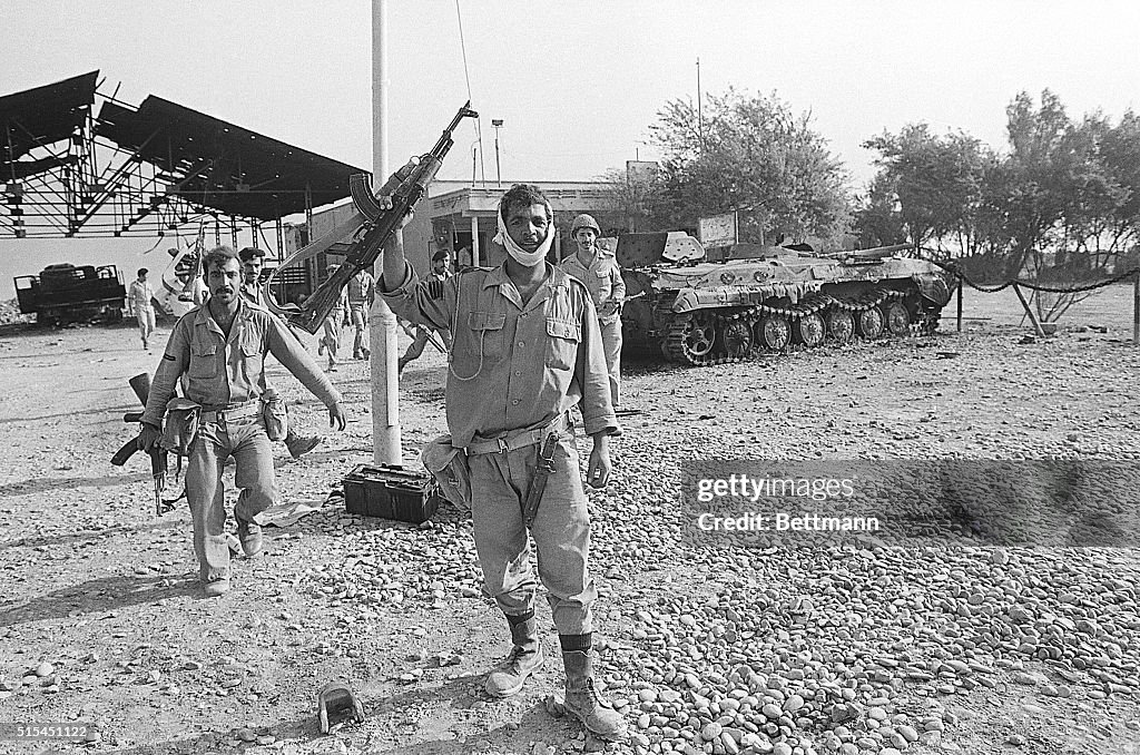 Iraqi Soldier Raises AK47 Rifle