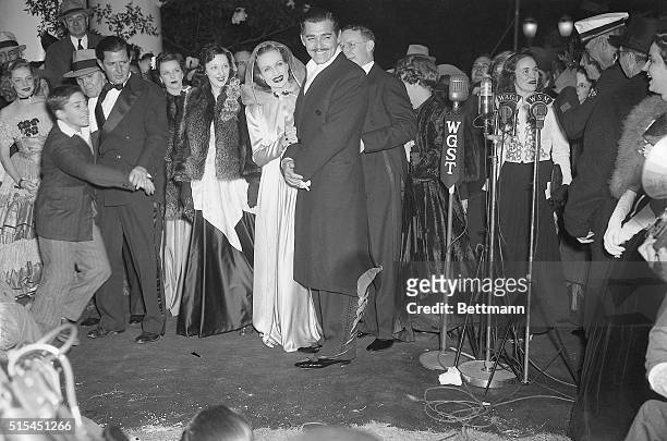 Carole Lombard and Clark Gable arrive at the Loew's Grand Theater in Atlanta for the world premiere of Gone with the Wind.