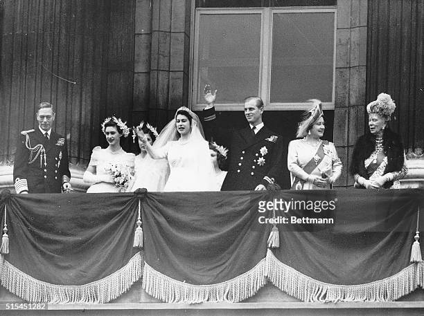 London, England- The Royal Party waving to the crowds on the balcony of the palace. Left to right - The King, Princess Margaret, the Duke of...