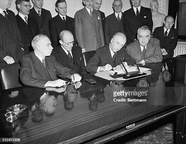 Washington, DC-In a ceremony at the Department of State, the British Loan Agreement was formally signed. Pictured during the signing are, left to...