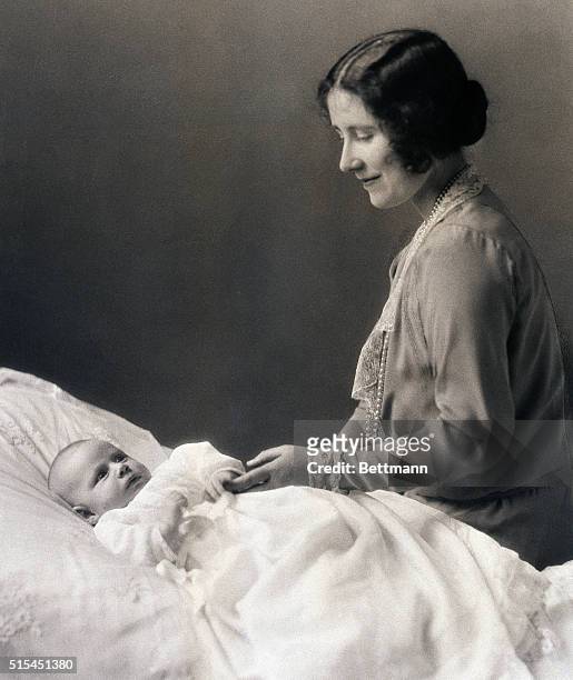London, England: The Duchess of York, now the Queen Mother Elizabeth, is shown with her infant daughter, Princess Margaret Rose, in this file photo...