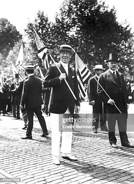 Washington, DC-Photo shows President Woodrow Wilson carrying the Nation's flag as he marched at the head of the great parade.