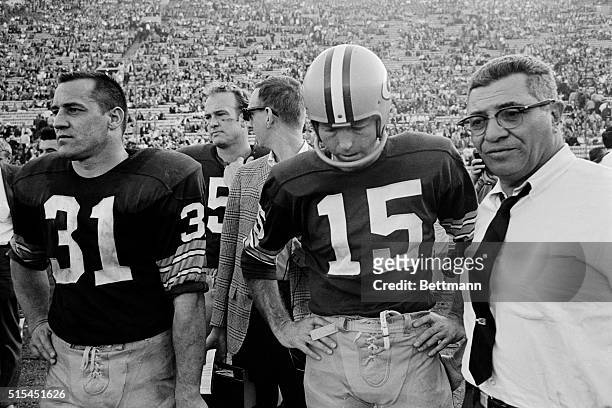 Los Anegels, CA- Green Bay Packers Vince Lombardi is shown with Jim Taylor and Bart Starr on the sidelines during the Super Bowl game against the...