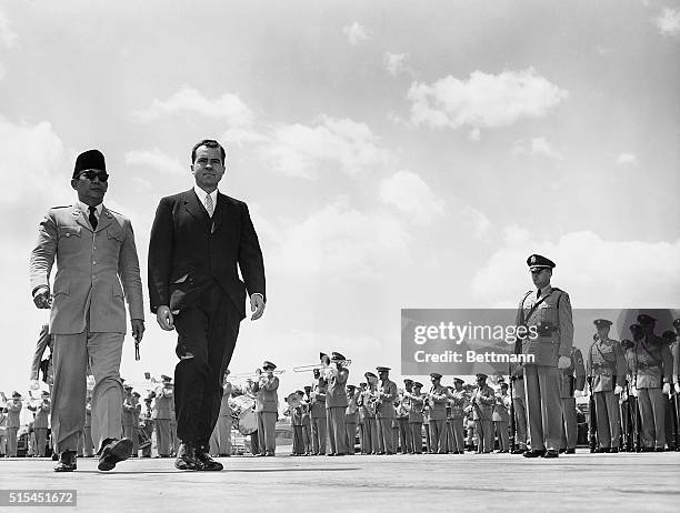 Washington, DC-: Indonesia's President Achmed Sukarno is escorted by Vice President Richard Nixon as the visiting Chief of State received full...