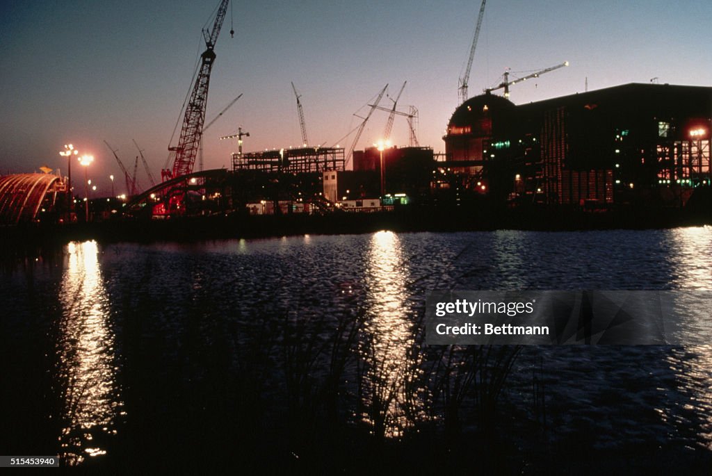 Nuclear Plant Silhouetted Against Sunset