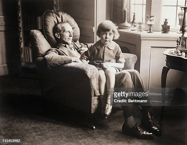 This charming photo shows Mr A.A. Milne, the famous British dramatist, author of 'Mr.Pim Passes By' and others, with his no less famous son,...