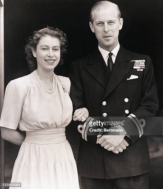 London, England- Princess Elizabeth, Britain's future queen, and Lt. Philip Mountbatten shown at Buckingham Palace. On her engagement finger, the...