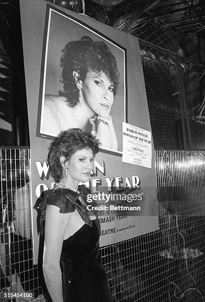 New York, NY- Raquel Welch, star of the Broadway hit "Woman of the Year," stands in front of a show poster during a party celebrating the show's...