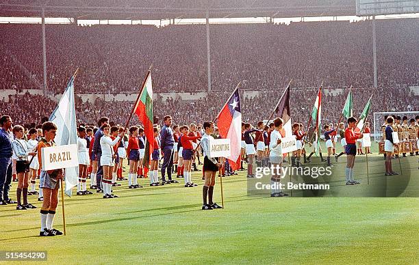 London, England-: At opening ceremony of the World Cup Soccer championships at Wembley Stadium, London schoolboys bear the banners and wear the...