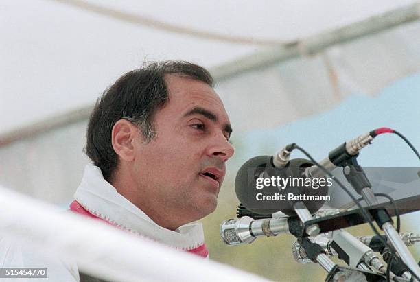 Portrait of Rajiv Gandhi, Prime Minister of India. He is shown close-up, standing at a microphone.