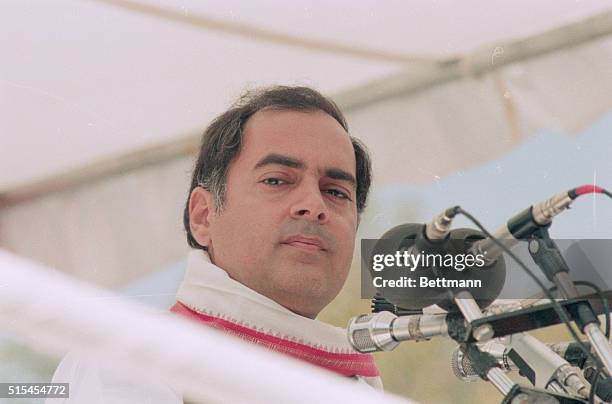 Portrait of Rajiv Gandhi, Prime Minister of India. He is shown close-up, standing at a microphone.