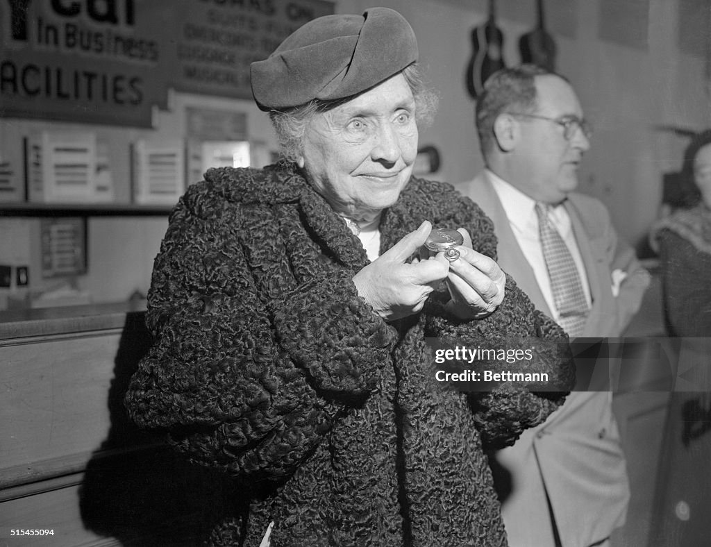 Helen Keller Holding Watch