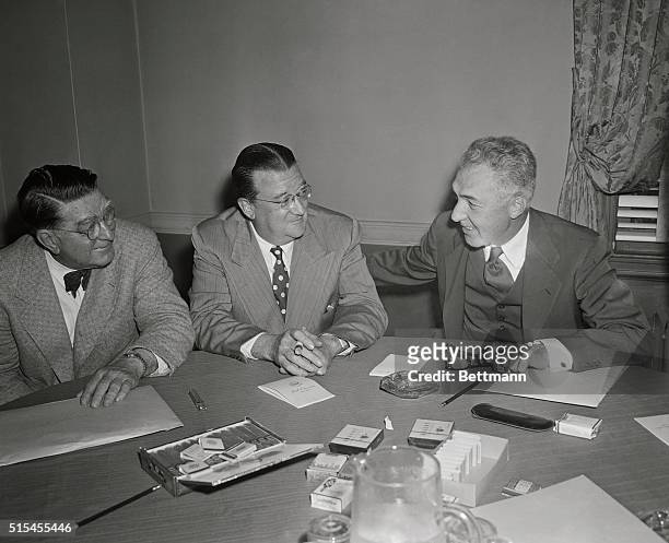 Photo shows left to right: Branch Rickey of the Pittsburgh Pirates, Walter O'Malley President of the Dodgers chat with Ford Frick,President of the...