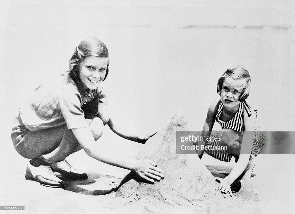 Grace Kelly Playing in Sand
