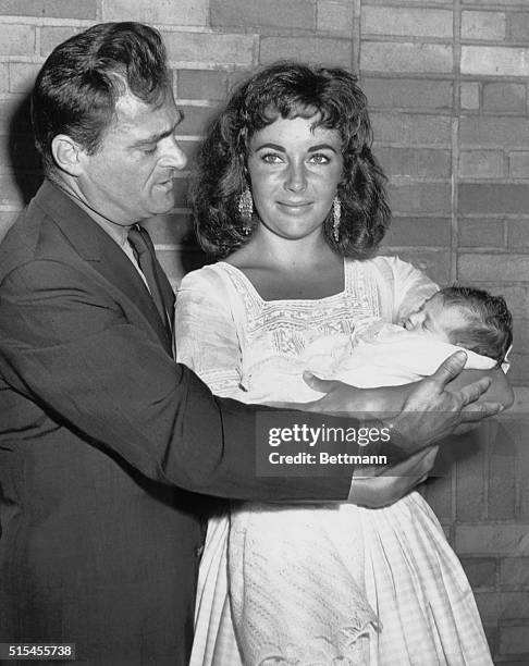 Elizabeth Taylor with baby, Liza and husband Mike Todd leaving Harkness Pavilion for home.