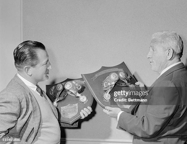 Actor Spencer Tracey and producer director Edward Dmytryk admire their Silver Spurs awards, the "Oscars" of western movies. The awards are presented...